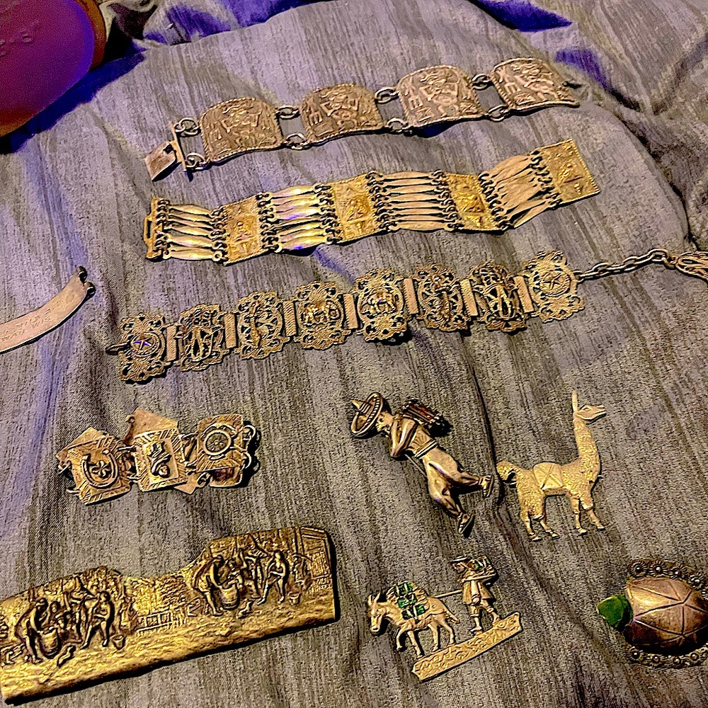 Vintage assorted pins and bracelets from around the world